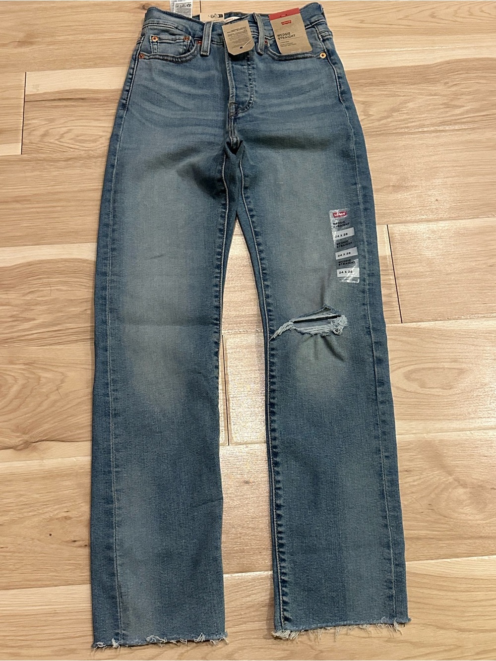 Levi's Women's Straight-Leg Jeans in Faded Blue with Knee Rip